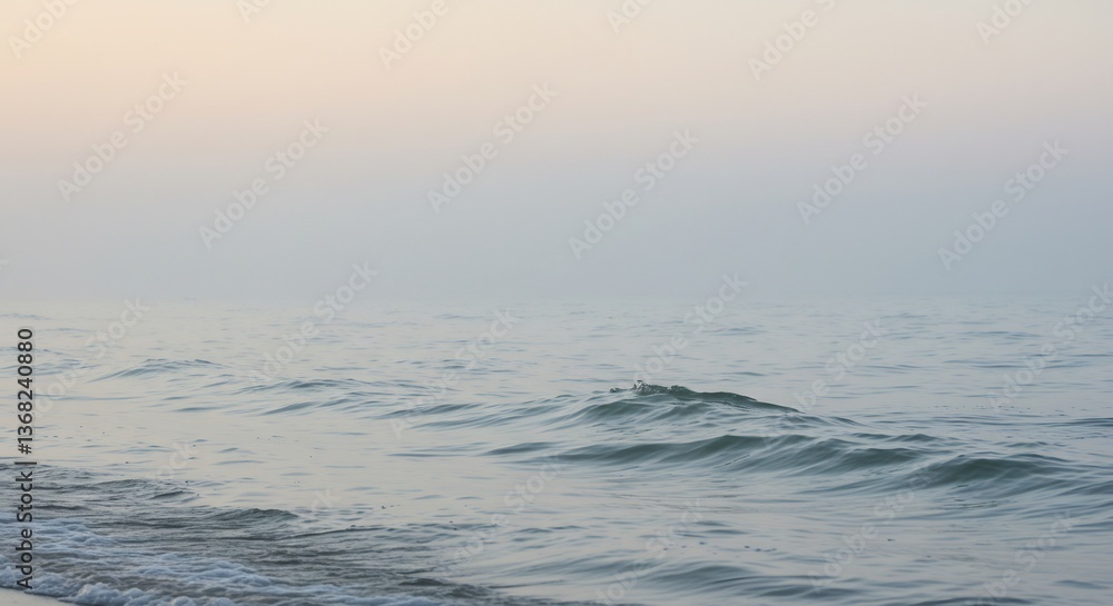 Fototapeta premium Serene ocean waves gently roll under soft dawn light. AI Generated