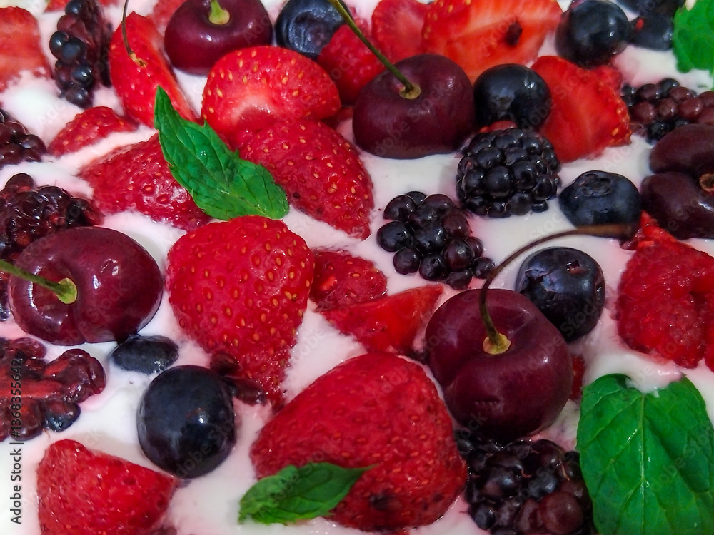 Cake topped with a variety of fresh berries Cake topped with a variety of fresh berries