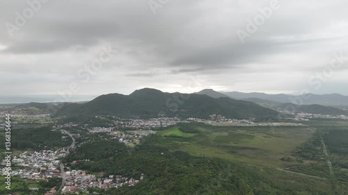 Explore lush hills and valleys near the coast in Mexico on a cloudy day
