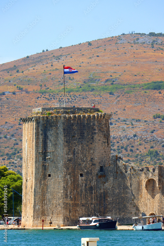 Historical Kamerlengo Fortress in Trogir, Croatia and Croatian flag.