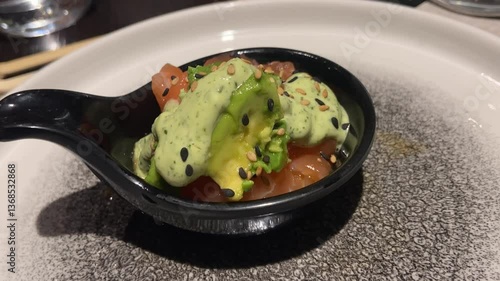 Fresh Salmon Tartare with Sauce Served at a Japanese Restaurant