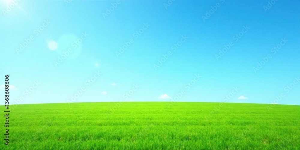 Fototapeta premium Serene Landscape Vibrant Green Field Under a Clear Azure Sky with Gentle Sunlight