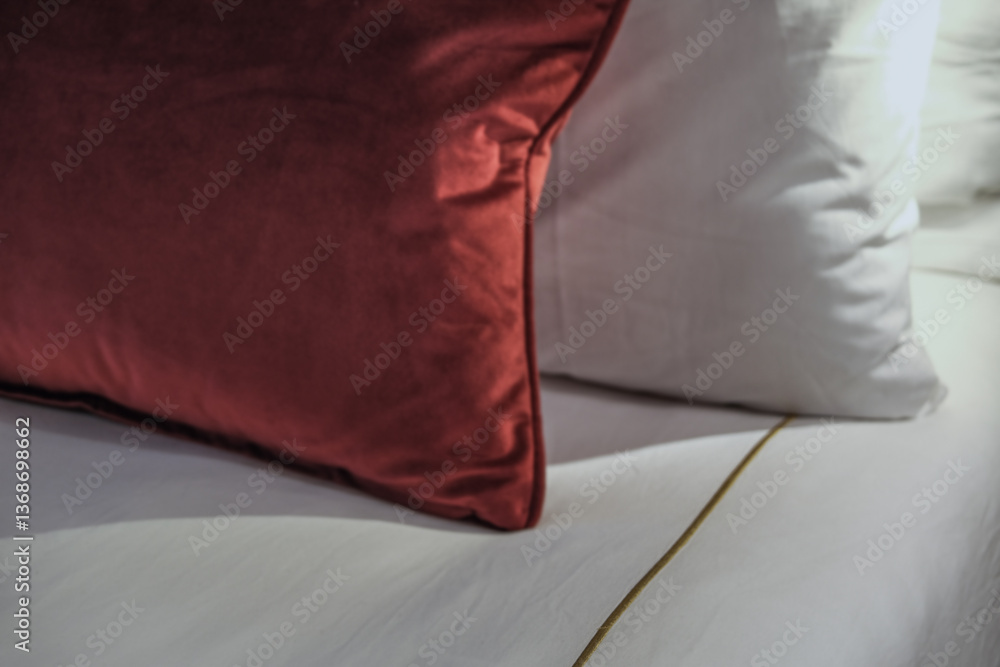 Luxurious mini suite stateroom cabin room onboard luxury cruise ship cruiseship ocean liner with bedroom and living area in red and creme with wood in modern Art Deco interior design