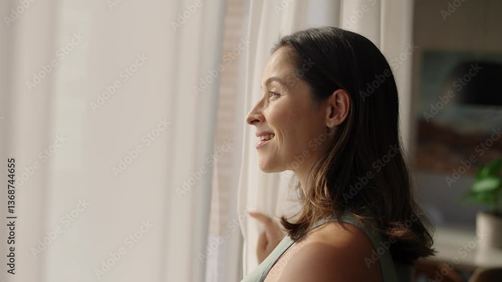 Close up at sunlight back view of silhouette young woman opens the curtains looking enjoying light and city view in the morning nature old city slow motion
Close up at sunlight back view of silhouette young woman opens the curtains looking enjoying light and city view in the morning nature old city slow motion