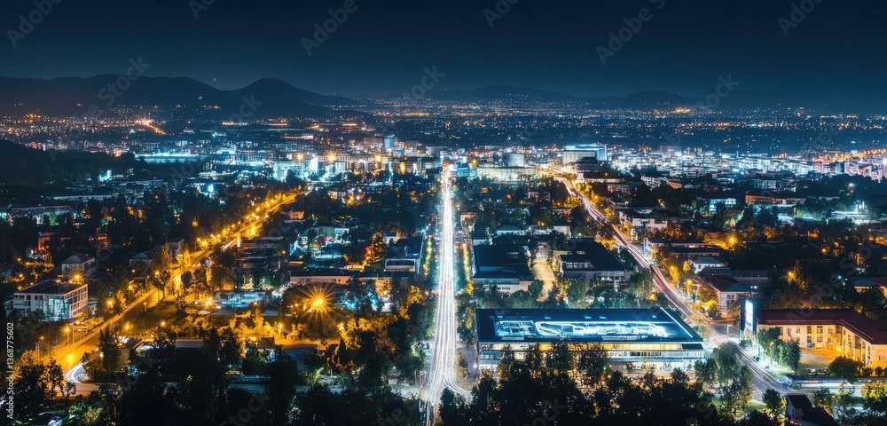 Fototapeta premium A wide shot of a smart city at night, with illuminated smart streets, connected homes, and automated public transport systems.