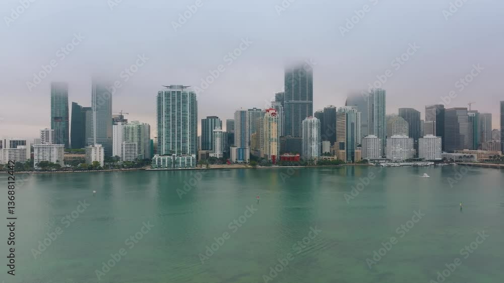 Experience the breathtaking and stunning aerial views of Downtown Miami, where you can see the charming Brickell Key and the vibrant, lively skyline that defines the citys essence Experience the breathtaking and stunning aerial views of Downtown Miami, where you can see the charming Brickell Key and the vibrant, lively skyline that defines the citys essence