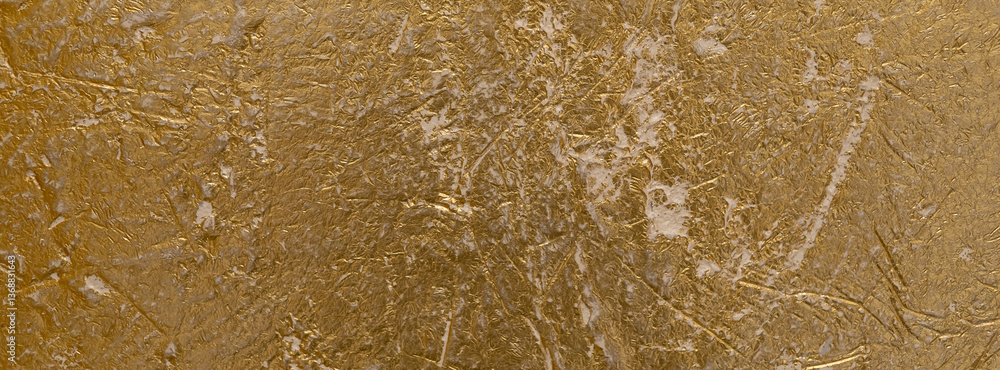 Abstract Textured Gold Venetian plaster Surface with Shimmering Highlights.