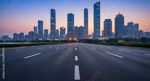 Wide asphalt highway leading to Guangzhou’s modern skyline, featuring towering skyscrapers and a vibrant urban landscape under a clear blue sky.