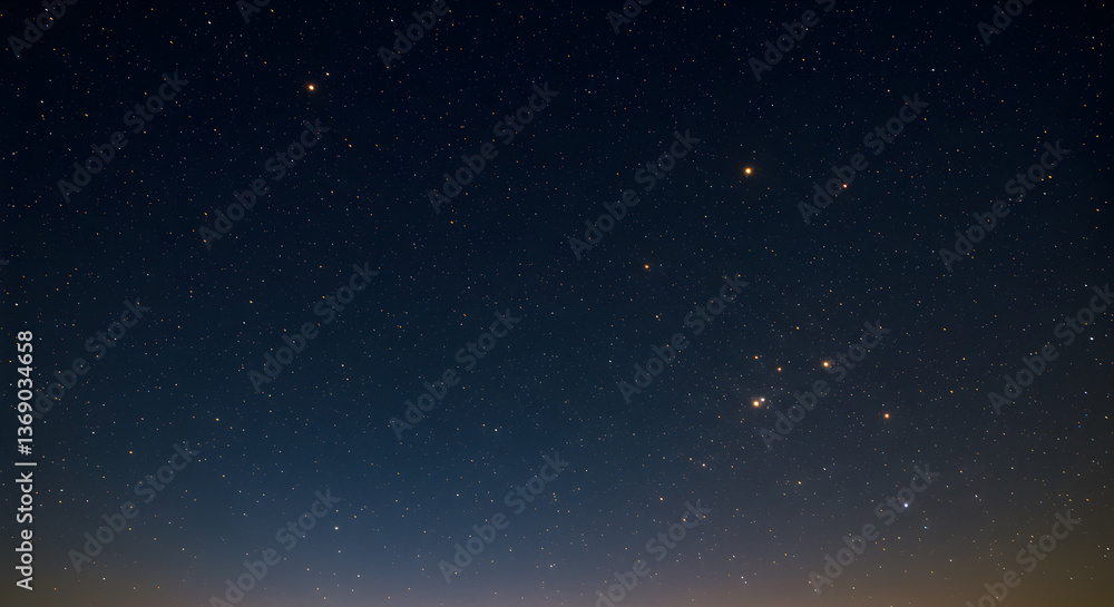 Fototapeta premium Enchanting midnight sky dotted with golden stars in a gradient of cosmic blues