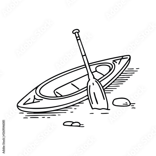 paddle lying on the sand beside an overturned kayak