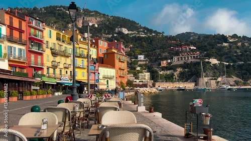 Sunny day in the south of France. Turquoise sea, colorful houses, marina and waterfront Villefranche-sur-Mer, Provence, Alps, Cote d'Azur France February 25, 2025. High quality 4k footage