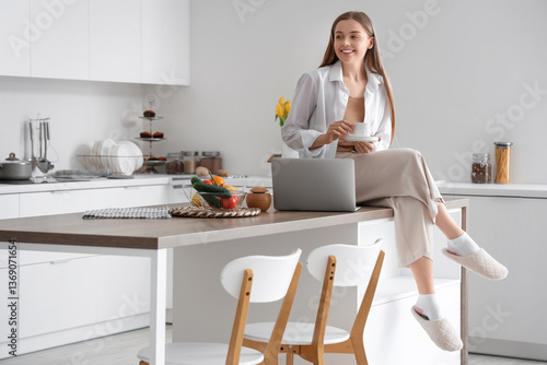 Happy young woman holding c...