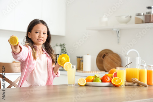 Little Asian girl making fr...