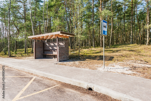 Bus stop in the forest.
