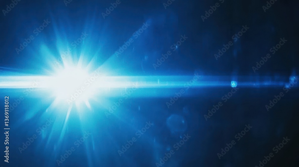 Obraz premium Bright blue light with lens flare, and beams shining in a dark background.