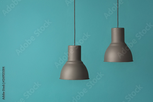 Obraz na płótnie Black modern pendant lamps on blue background w salonie