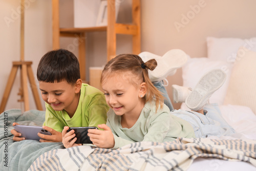 Happy young children lying ...