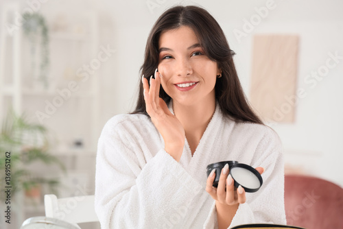 Beautiful young woman apply...