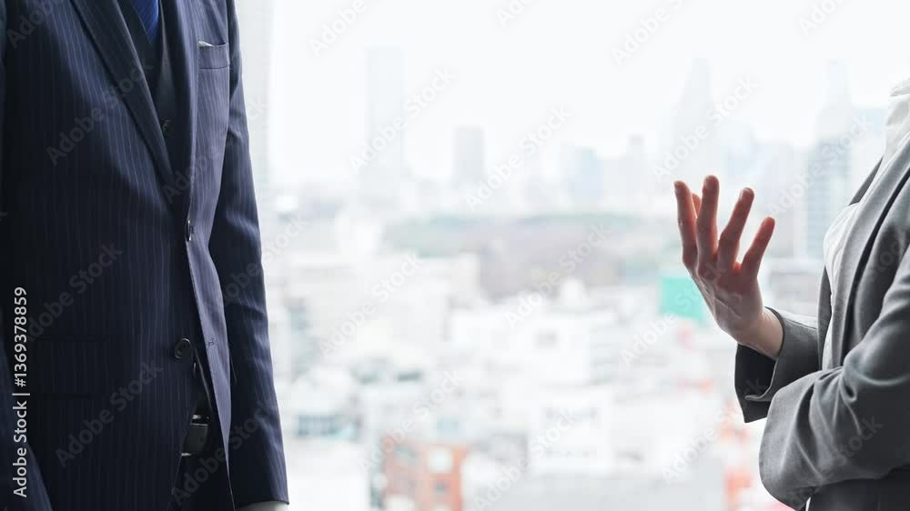 Group of business people having a conversation in an office Group of business people having a conversation in an office