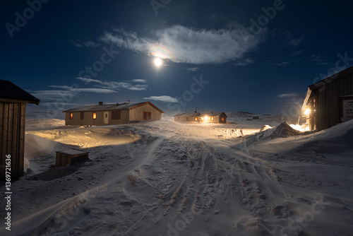 Obraz na płótnie Full moon over Helags Mountain station in Jämtland, Sweden, during a cold and windy night in March. w salonie