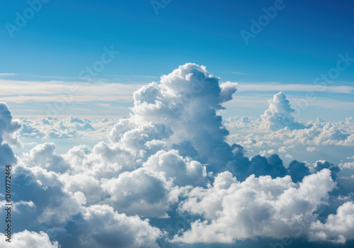 A breathtaking aerial perspective of puffy white clouds blanketing the azure sky.