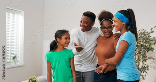 Happy family stands in middle of apartment for rent sale, they look at house, the father asks his wife and children what they think about living there, he gestures pointing to the whole room