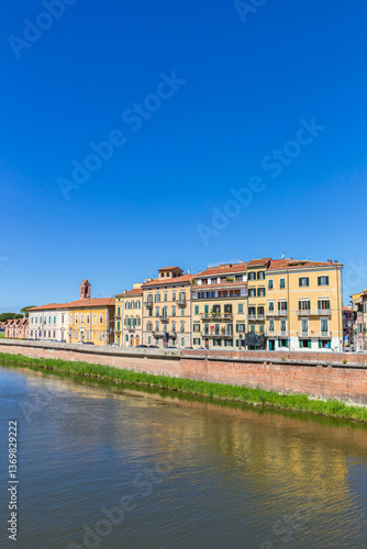 Obraz na płótnie Colorful houses at the quayside of the Arno river in Pisa, Italy w salonie
