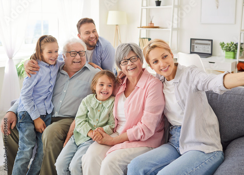 Fotografi Multi generational family taking selfie capturing happy moment all together