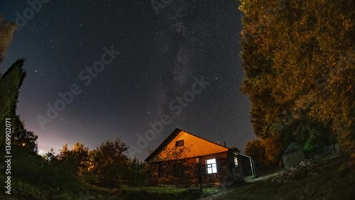 Country house against the backdrop of the starry sky and the Milky Way