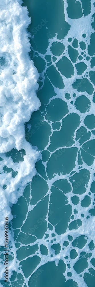 Obraz premium Aquatic Abstraction: An aerial perspective captures the dynamic textures of the ocean, highlighting the interplay of turquoise waters and frothy white waves