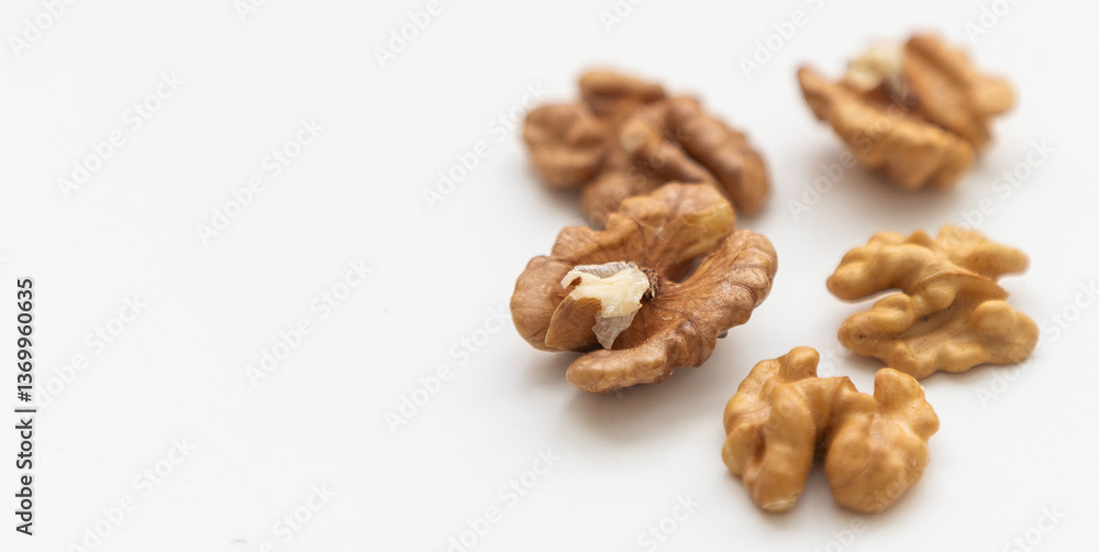 Half a walnut isolate. Peeled walnut on white. Walnut top view. Set with clipping path. Full depth of field Half a walnut isolate. Peeled walnut on white. Walnut top view. Set with clipping path. Full depth of field