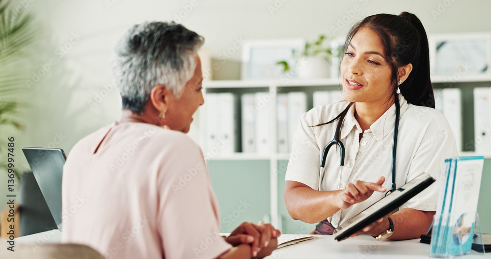 Appointment, healthcare or tablet with doctor and patient in office of hospital for consulting. Conversation, feedback or medical report with medicine professional and mature woman in clinic Appointment, healthcare or tablet with doctor and patient in office of hospital for consulting. Conversation, feedback or medical report with medicine professional and mature woman in clinic