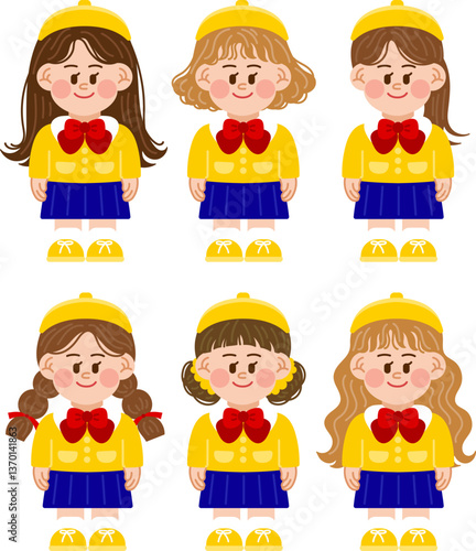 Girls in kindergarten uniforms. Kindergarten children in hats and uniforms with ribbons.