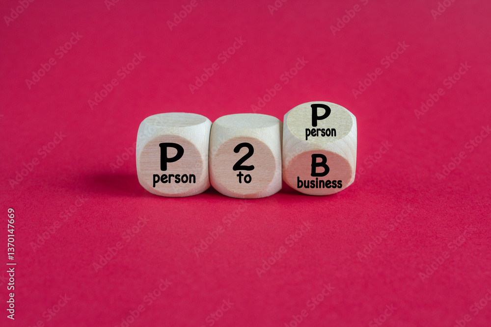 Cubes form the expression P2P Person To Person and P2B Person To Business. Beautiful red background. Business concept.