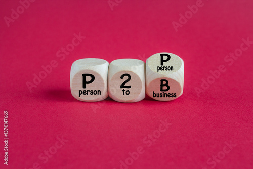 Obraz na płótnie Cubes form the expression P2P Person To Person and P2B Person To Business. Beautiful red background. Business concept. w salonie