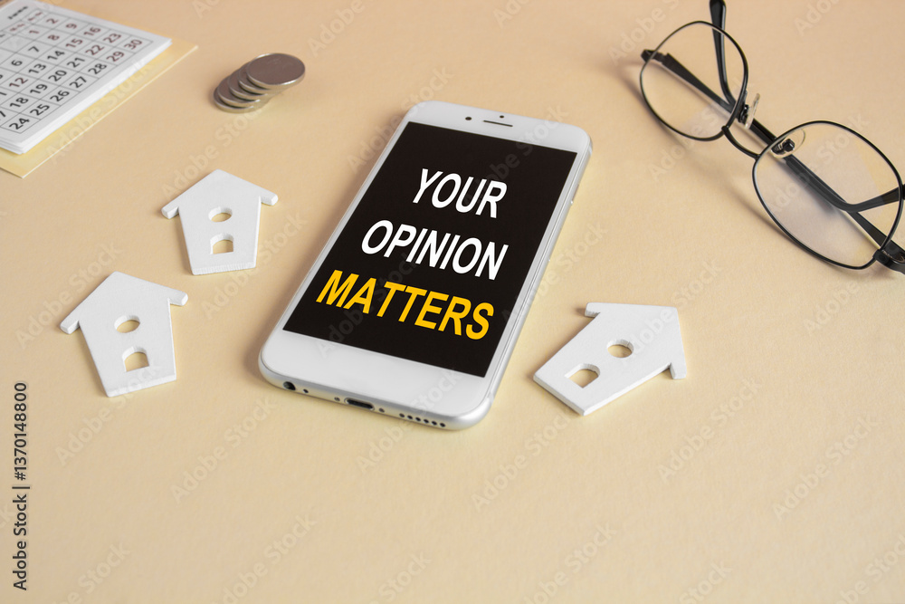 The expression Your opinion matters on the mobile phone screen. Beautiful beige background. Glasses, miniature houses, coins. Business concept.