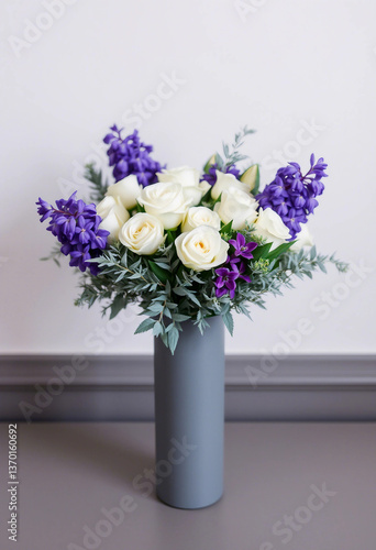 Wallpaper Mural A beautiful floral arrangement displaying white roses and vibrant purple flowers, set in a sleek gray vase, exuding sophistication, freshness, and elegance. Ideal for decor, gifting, or celebrating sp Torontodigital.ca