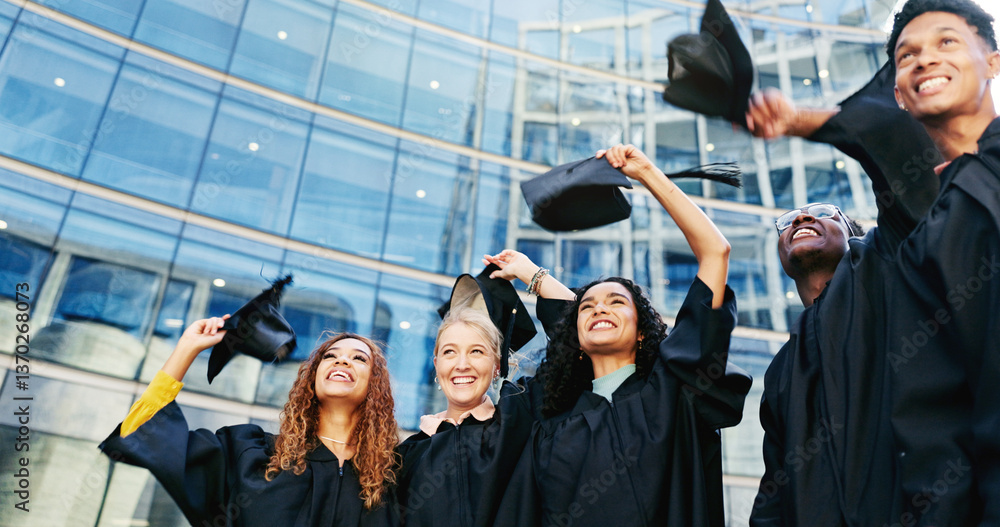 Obraz premium Happy, students and throw hats for graduation of learning success, class achievement and celebrate. Below, people and tradition with support, academic degree and bonding together for college ceremony