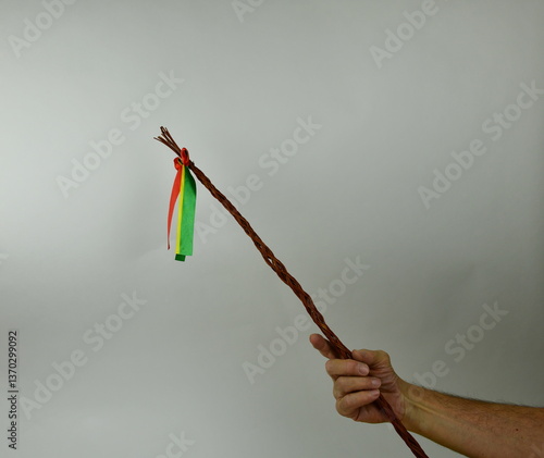 Traditional Czech Easter whip with colored ribbons 
from willow branches in my hand