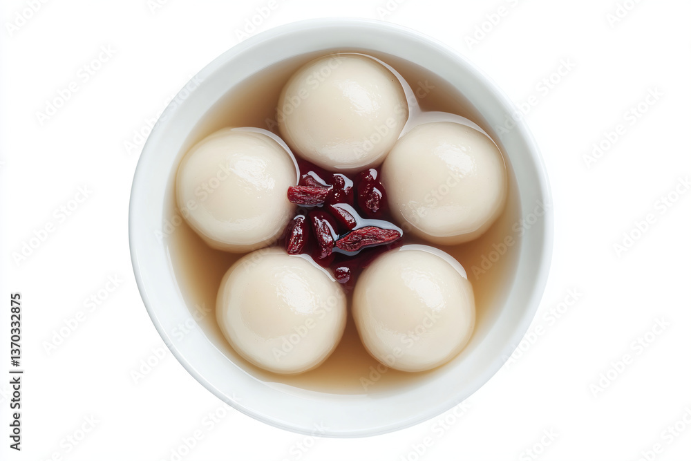 a bowl of soup with a few balls of soup in it