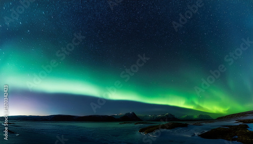 Beautiful green northern lights (aurora borealis) on a night full of stars in the background