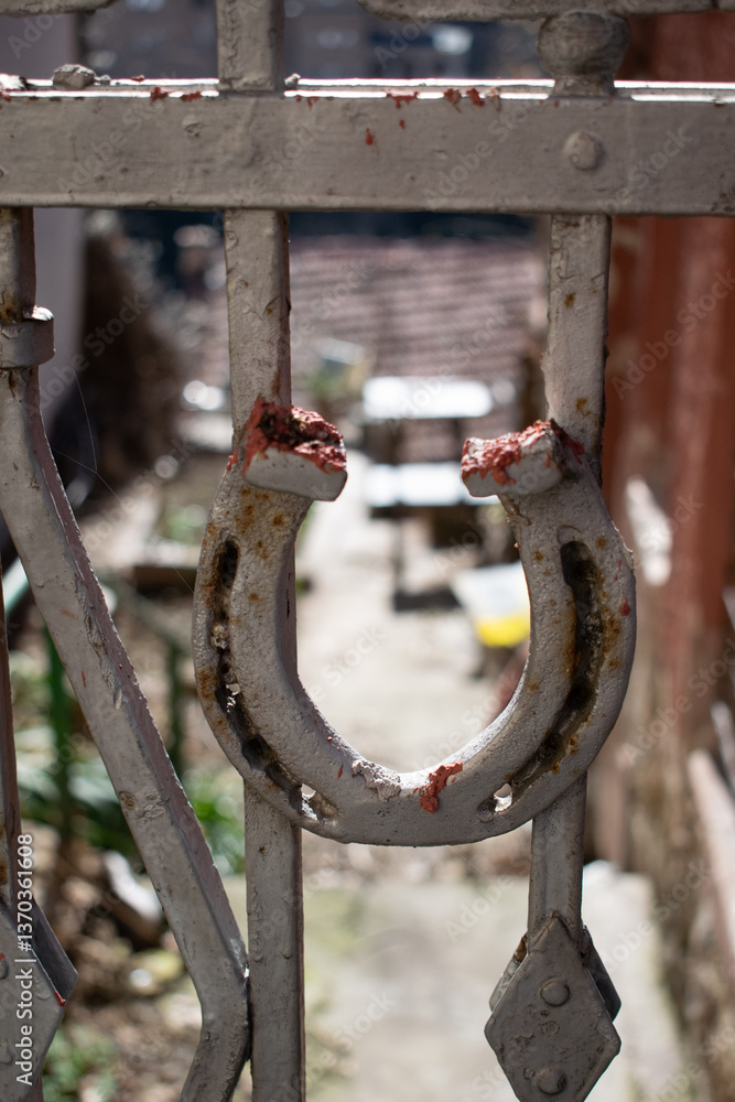 Rusty Horseshoe Hanging on a Metal Gate Rusty Horseshoe Hanging on a Metal Gate