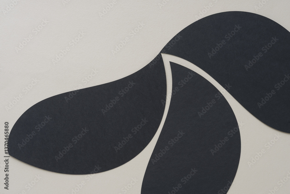 black paper forms with tapered ends arranged in lyrical form on blank paper black paper forms with tapered ends arranged in lyrical form on blank paper