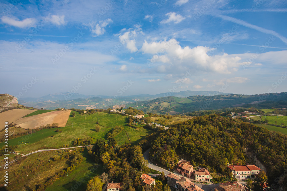 Fototapeta premium Experience the breathtaking and stunning aerial view of rolling green hills during autumn