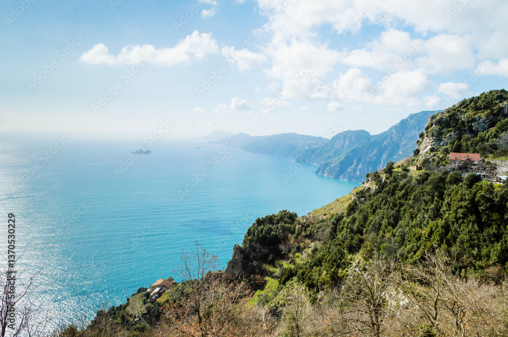 Panoramic view from hiking trail Path of Gods between coastal towns Positano and Praiano. Trekking in Lattari Mountains, Apennines, Amalfi Coast, Campania, Italy, Europe. Coastline Mediterranean Sea. Panoramic view from hiking trail Path of Gods between coastal towns Positano and Praiano. Trekking in Lattari Mountains, Apennines, Amalfi Coast, Campania, Italy, Europe. Coastline Mediterranean Sea.