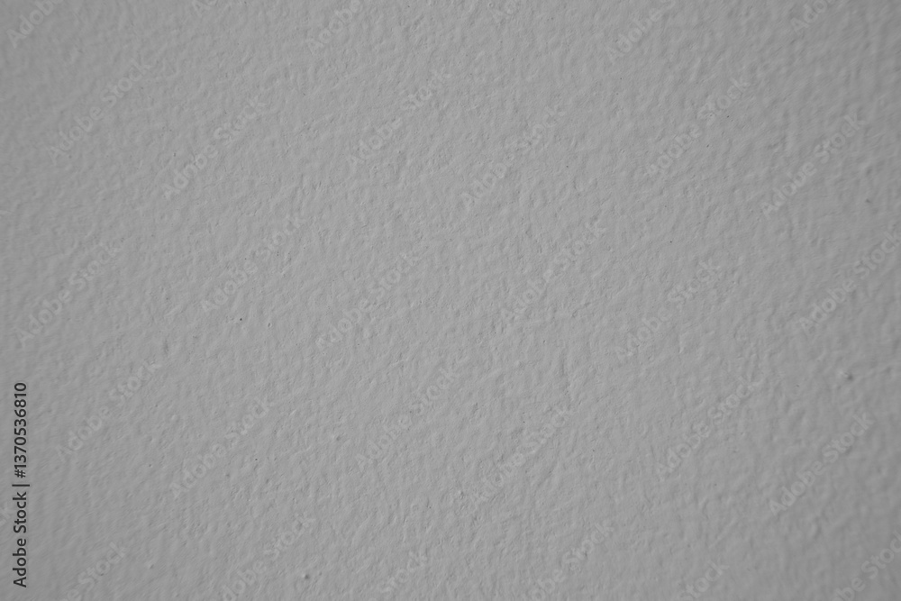 Rough gray textured background creating a grainy surface ideal for design projects Rough gray textured background creating a grainy surface ideal for design projects