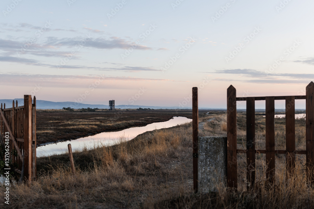 Fototapeta premium Beautiful sunset or sunrise on the wetland National Park Delta Evros in Thrace Greece near to Feres and Alexandroupolis, near Greek Turkish borders, panoramic view