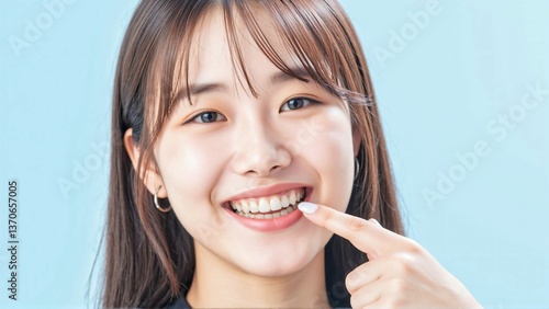 Close-up of a beautiful woman smiling with perfectly white teeth - a striking image ideal for advertising dental clinics and related products, showcasing effective teeth whitening results