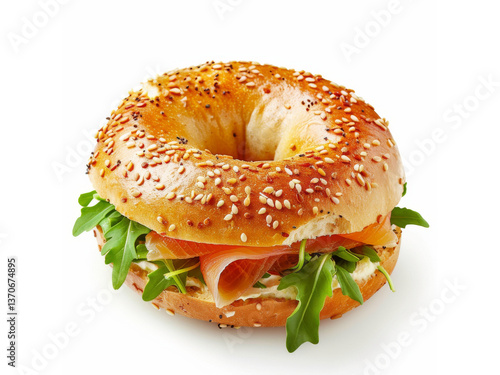 delicious sesame seed bagel filled with smoked salmon, cream cheese, and fresh arugula on white background