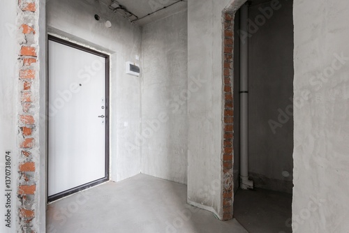 interior of the apartment without decoration in gray colors. rough finish